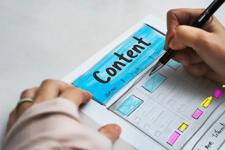A person writing content and adding colors or highlights – showing creative work by the best content marketing services in Dubai