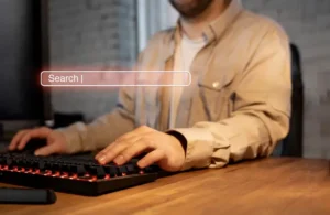 A man searches for something on a laptop – illustrating desktop SEO analysis and strategy planning, showcasing professional services for the best SEO in Dubai